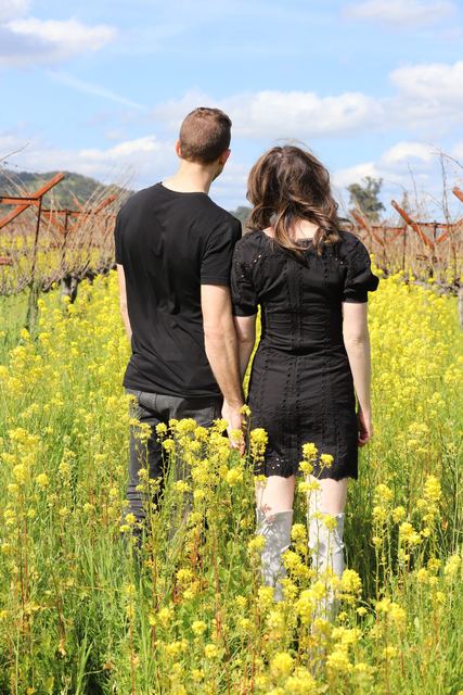 The couple looking out over the vineyard